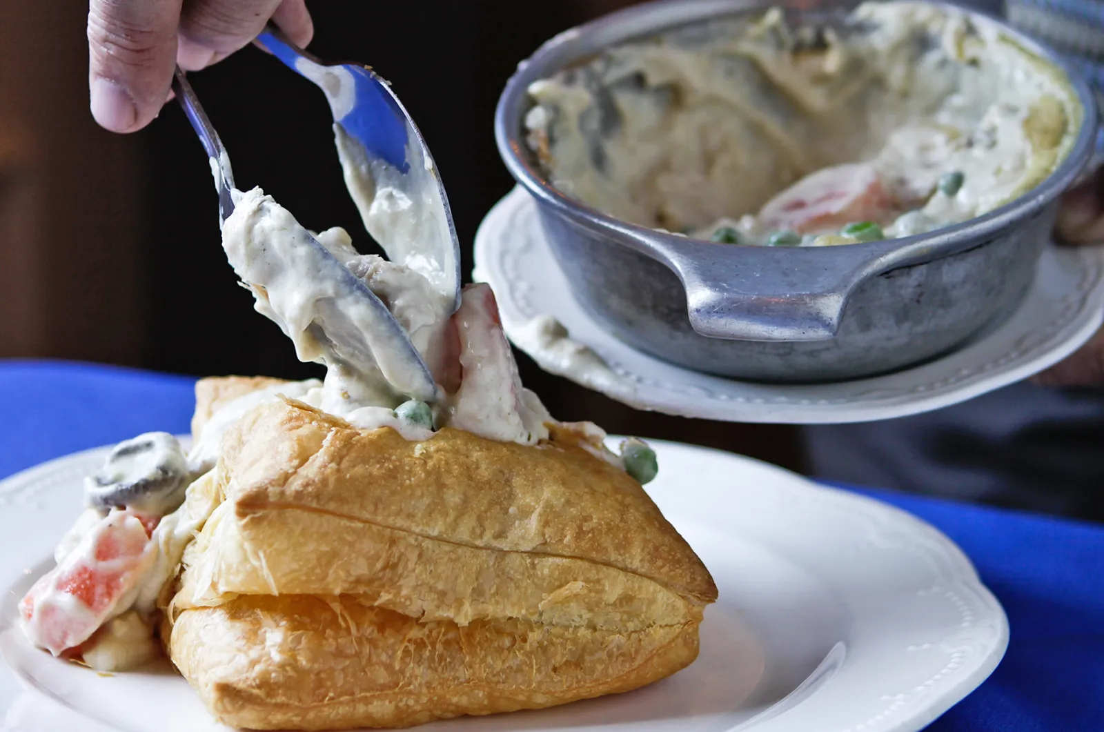 Chicken Pot Pie being served in house-baked puff pastry